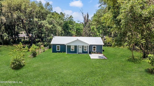 207 Palmetto Ave N, Florahome, FL 32140 - view of front of house with metal roof