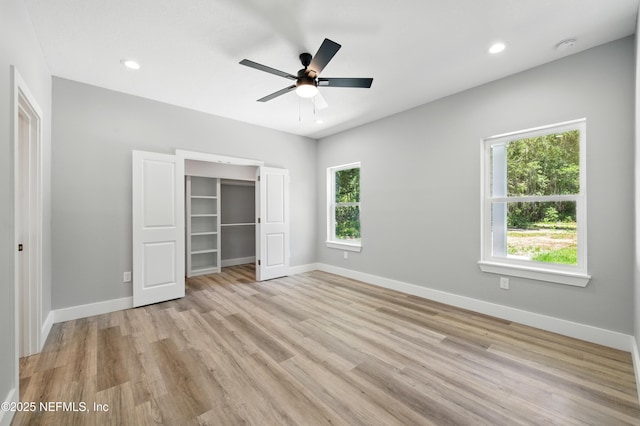 207 Palmetto Ave N, Florahome, FL 32140 - unfurnished bedroom with light wood-style flooring, baseboards, recessed lighting, a closet, and a ceiling fan