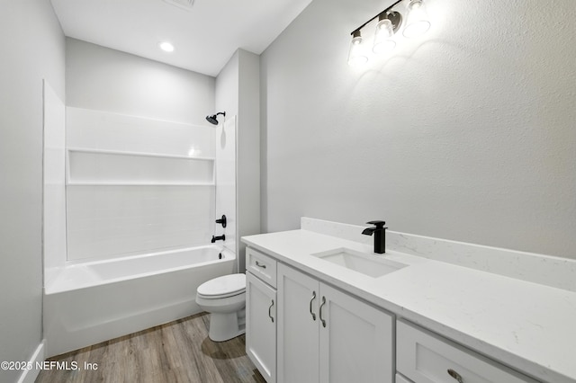 207 Palmetto Ave N, Florahome, FL 32140 - bathroom featuring wood finished floors, toilet, vanity, and shower / washtub combination