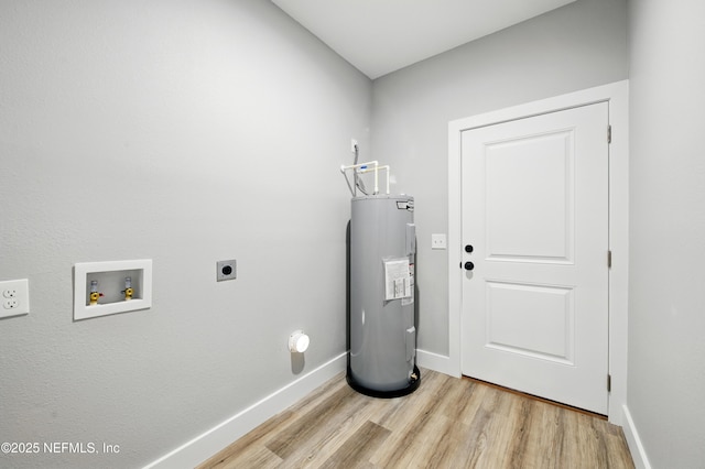 207 Palmetto Ave N, Florahome, FL 32140 - washroom featuring electric water heater, hookup for an electric dryer, washer hookup, light wood finished floors, and baseboards