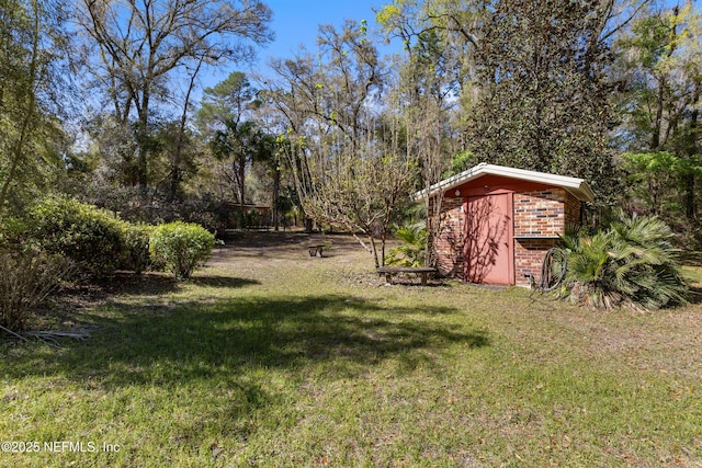 view of yard with an outbuilding and a storage shed