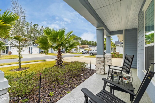 view of patio with a porch and a residential view