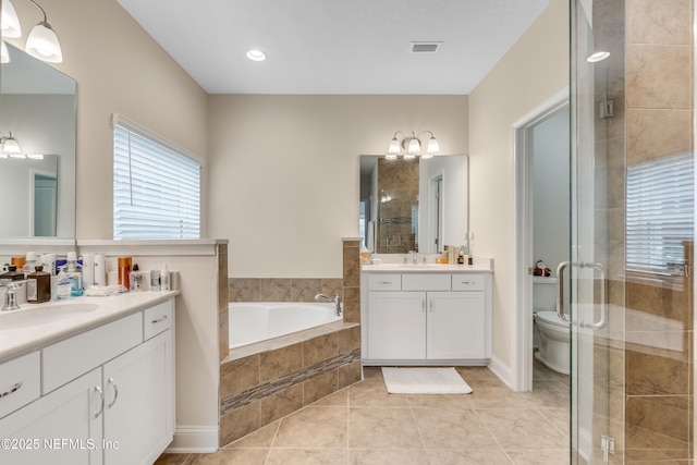 full bathroom with tile patterned flooring, a stall shower, a bath, and a sink