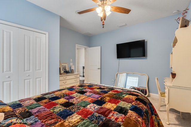 bedroom featuring carpet flooring, a ceiling fan, visible vents, and a closet