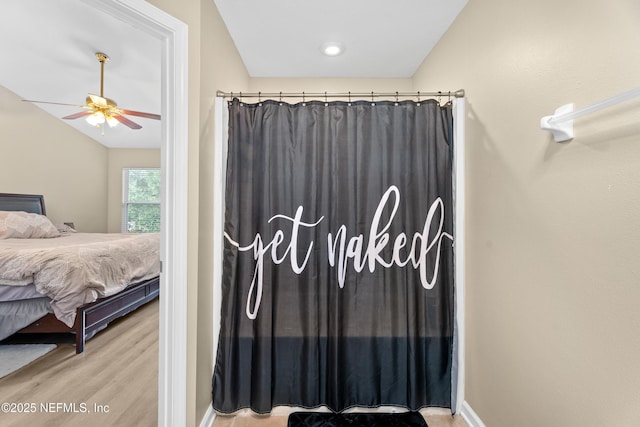 7540 Scarlet Ibis Ln, Jacksonville, FL 32256 - bedroom featuring vaulted ceiling, a ceiling fan, and wood finished floors