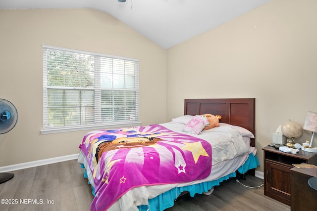 7540 Scarlet Ibis Ln, Jacksonville, FL 32256 - bedroom featuring vaulted ceiling, wood finished floors, and baseboards