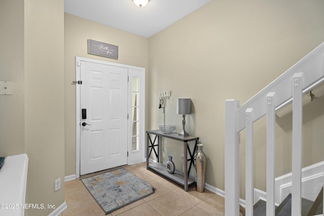 7540 Scarlet Ibis Ln, Jacksonville, FL 32256 - foyer featuring light tile patterned flooring and baseboards