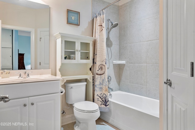 full bathroom featuring toilet, shower / bath combo, and vanity