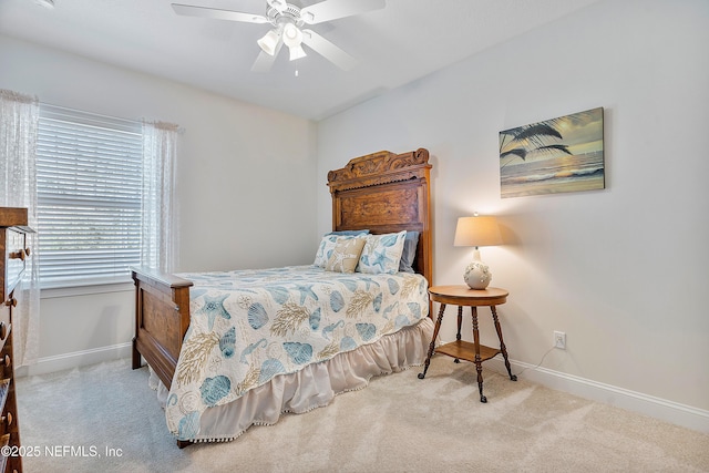 bedroom with carpet flooring, a ceiling fan, and baseboards