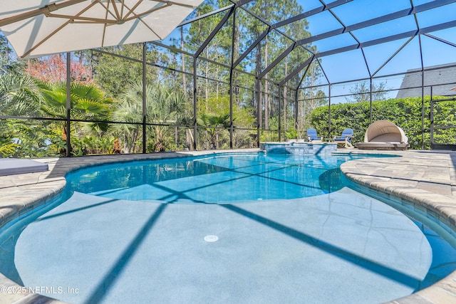 outdoor pool with a lanai and a patio area