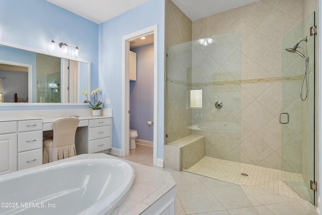 full bathroom with tile patterned flooring, toilet, a garden tub, a stall shower, and vanity