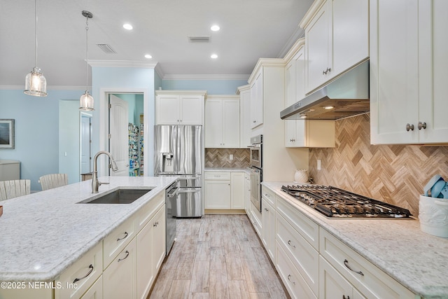 kitchen with ornamental molding, decorative backsplash, stainless steel appliances, a sink, and under cabinet range hood