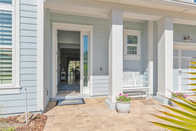 property entrance featuring covered porch