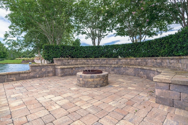 view of patio / terrace featuring an outdoor fire pit