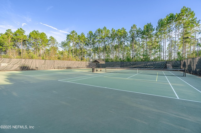 view of sport court with community basketball court and fence