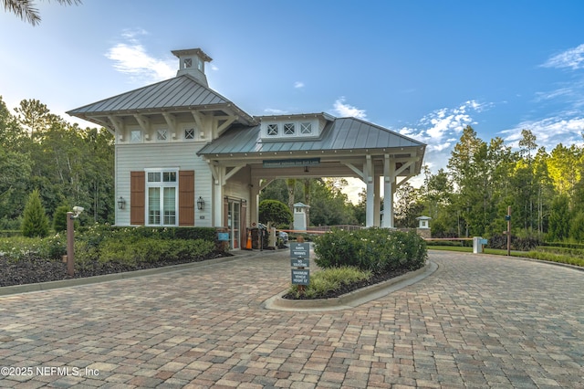 view of community featuring decorative driveway