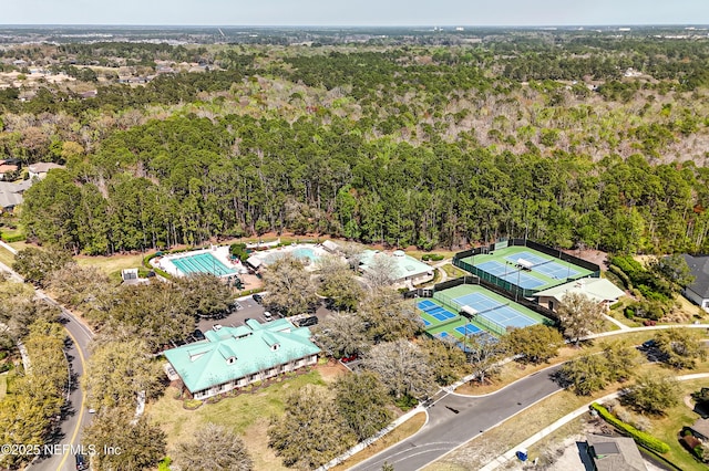 birds eye view of property with a forest view