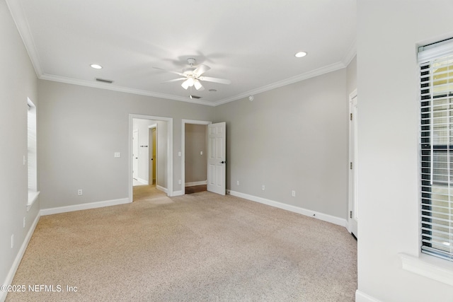 unfurnished bedroom with visible vents, recessed lighting, crown molding, baseboards, and light colored carpet