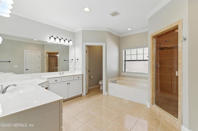 bathroom featuring a sink, a stall shower, tile patterned flooring, and ornamental molding