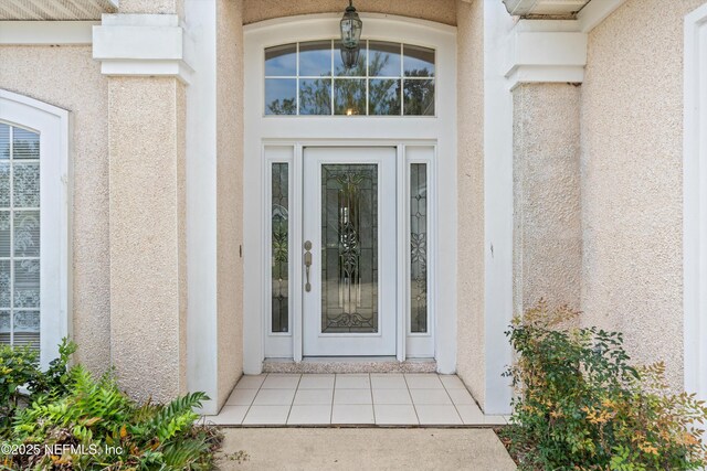 523 Lakeway Dr, Saint Augustine, FL 32080 - view of exterior entry featuring stucco siding
