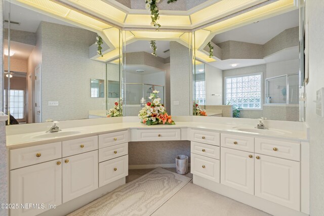523 Lakeway Dr, Saint Augustine, FL 32080 - full bathroom featuring double vanity, a sink, and a shower stall