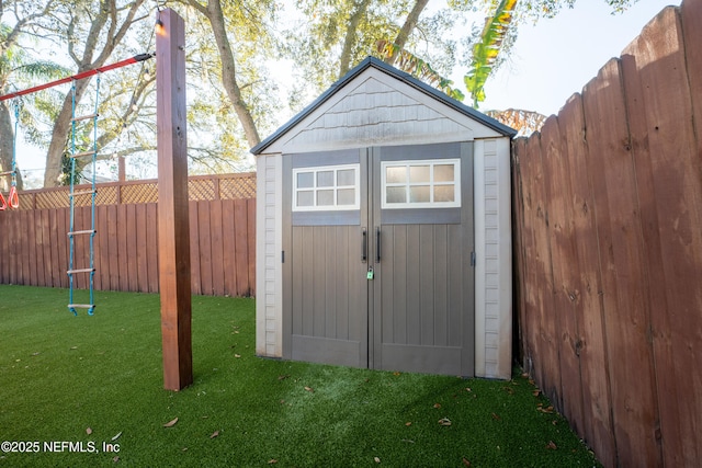 view of shed with a fenced backyard