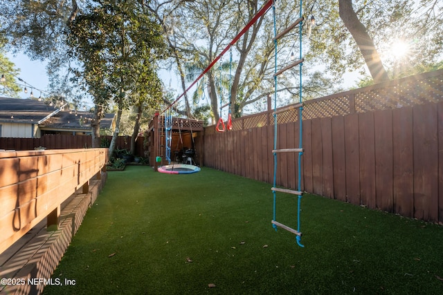 view of yard with a fenced backyard