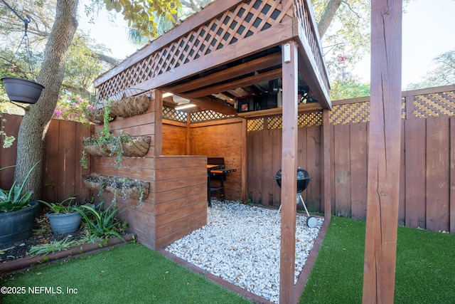 view of patio featuring fence and grilling area