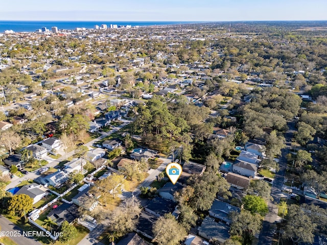 birds eye view of property with a water view and a residential view