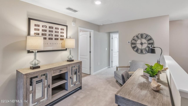 interior space featuring recessed lighting, visible vents, baseboards, and light colored carpet