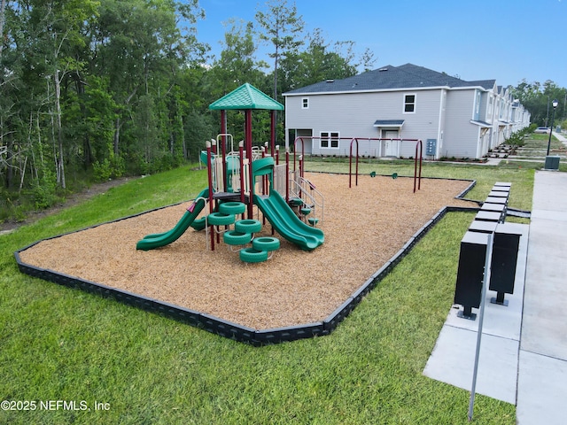 communal playground featuring a yard