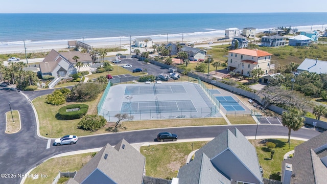 birds eye view of property featuring a view of the beach and a water view