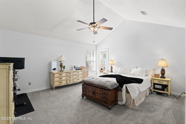 carpeted bedroom featuring a ceiling fan, visible vents, baseboards, and high vaulted ceiling