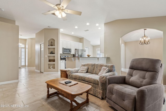 living room featuring lofted ceiling, ceiling fan with notable chandelier, recessed lighting, arched walkways, and baseboards