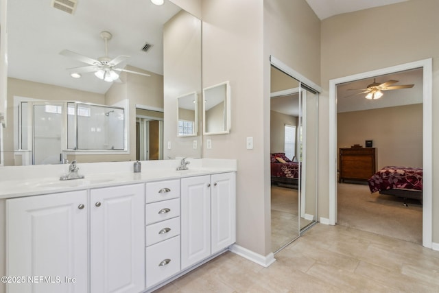 full bathroom featuring a sink, visible vents, ensuite bath, and a ceiling fan