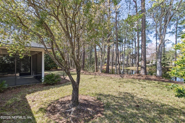 view of yard featuring a sunroom