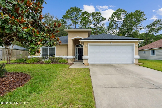 96231 Abaco Island Dr, Fernandina Beach, FL 32034 - single story home featuring stucco siding, a front lawn, concrete driveway, a garage, and roof with shingles