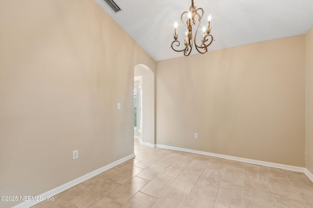 96231 Abaco Island Dr, Fernandina Beach, FL 32034 - empty room with arched walkways, a chandelier, light tile patterned flooring, and vaulted ceiling
