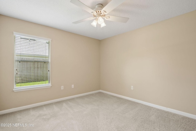 96231 Abaco Island Dr, Fernandina Beach, FL 32034 - carpeted empty room featuring healthy amount of natural light and a ceiling fan