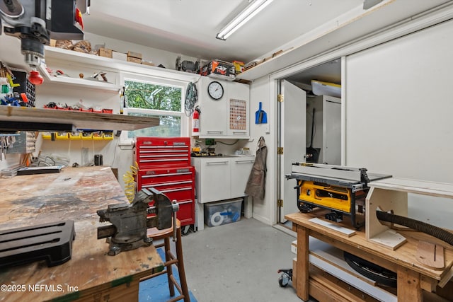 interior space with a workshop area and finished concrete flooring