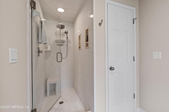 bathroom featuring a shower stall