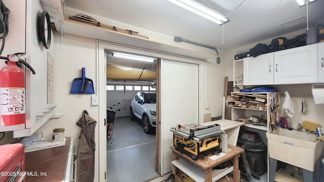 garage featuring a sink and a workshop area