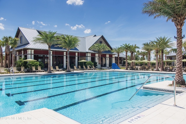 community pool with a patio area