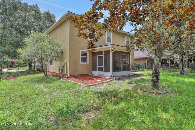 1601 Majestic View Ln, Fleming Island, FL 32003 - back of property featuring a sunroom, a fenced backyard, and stucco siding