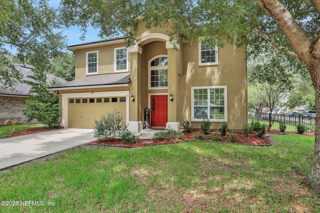 1601 Majestic View Ln, Fleming Island, FL 32003 - view of front facade with an attached garage, driveway, and stucco siding