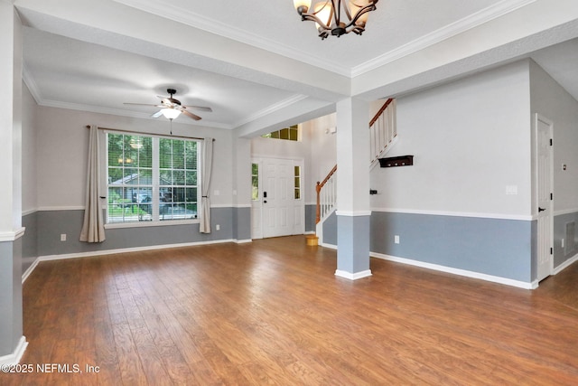 1601 Majestic View Ln, Fleming Island, FL 32003 - unfurnished living room with wood finished floors, stairway, a chandelier, ornamental molding, and a ceiling fan