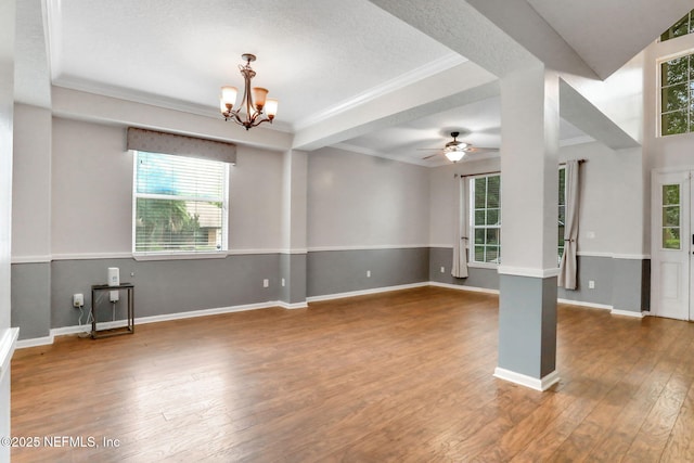 1601 Majestic View Ln, Fleming Island, FL 32003 - unfurnished living room with healthy amount of natural light, hardwood / wood-style floors, a chandelier, ceiling fan, and ornamental molding