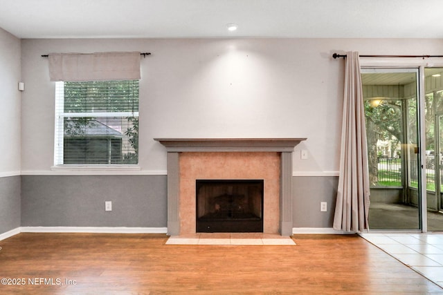 1601 Majestic View Ln, Fleming Island, FL 32003 - unfurnished living room featuring wood finished floors and a fireplace