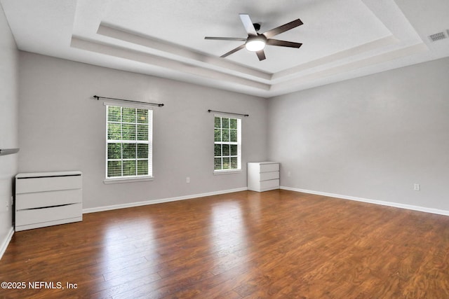1601 Majestic View Ln, Fleming Island, FL 32003 - spare room featuring a raised ceiling, ceiling fan, and wood finished floors