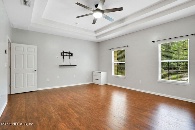 1601 Majestic View Ln, Fleming Island, FL 32003 - unfurnished room with a tray ceiling, wood finished floors, and a ceiling fan